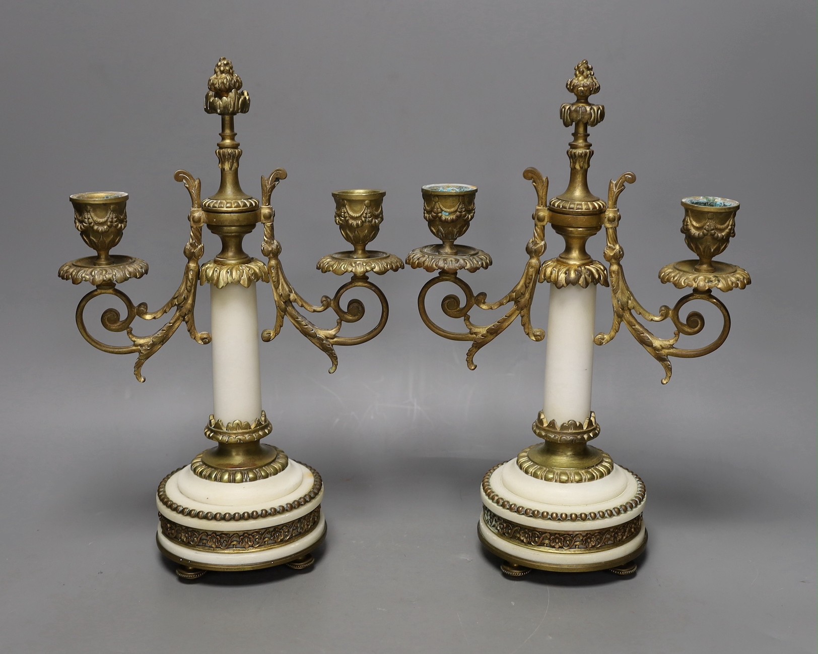 A pair of gilt bronze and marble two branch candelabra, 30cms high